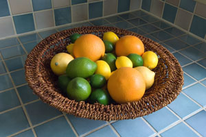 blue ceramic tile countertop with citrus fruit basket